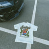 White t-shirt with graphic design on a black car hood